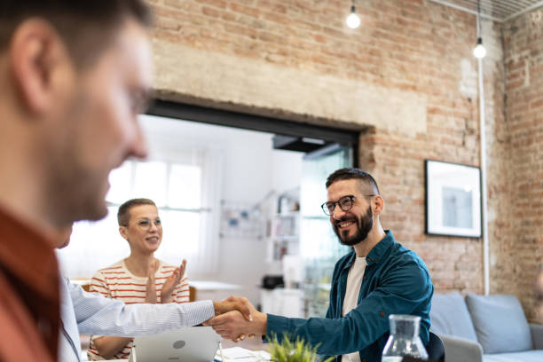 istock Business persons shaking hands on a meeting. 2183327845