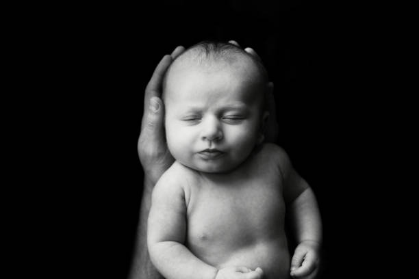 istock Baby Boy in Dad's Hands 2183328935