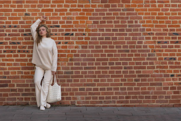 Free Stock Photo of Woman With Long Hair Standing in Front of Brick ...