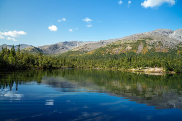 istock Serene Mountain Landscape with Clear Reflective Lake Under Blue Sky 2183335061