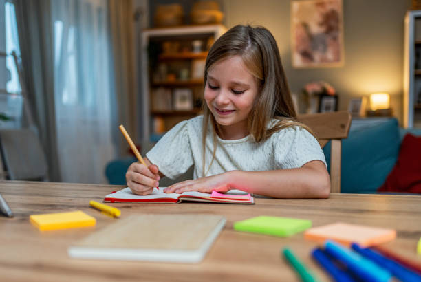 istock Girl doing homework at home 2183335930
