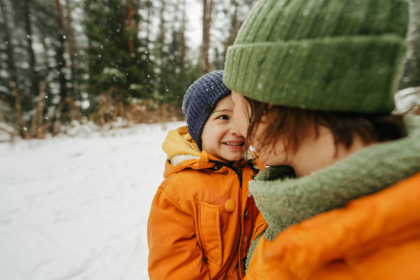 istock Mother and son at the snowy mountain 2183340684