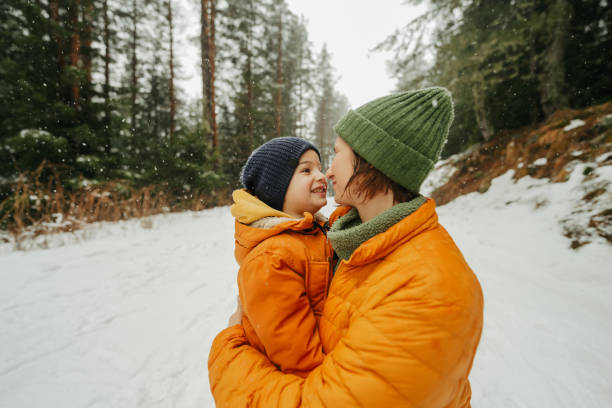 istock Mother and son at the snowy mountain 2183340705