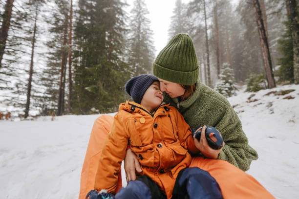 istock Mother and son at the snowy mountain 2183340753