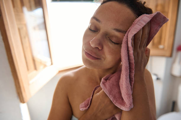 istock Woman enjoying a refreshing face wash routine at home 2183356160