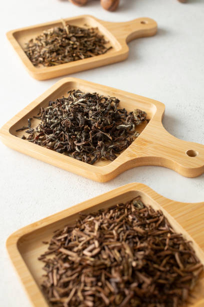 istock bamboo saucers, tea leaves 2183358760