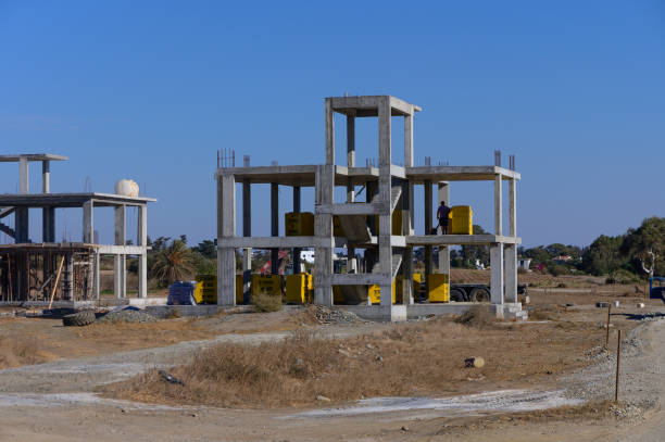 istock Construction progress on a modern building site under a clear blue sky in the afternoon sun 2183363142