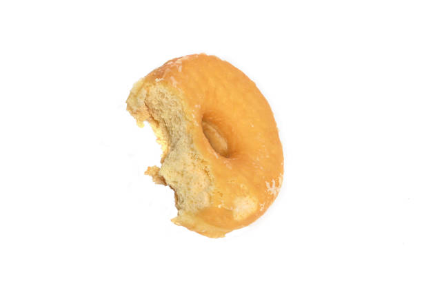 istock Close-up of a bitten donut isolated on a white background 2183365449