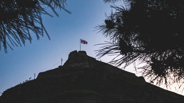 istock Georgian flag with nature landscape background 2183370811
