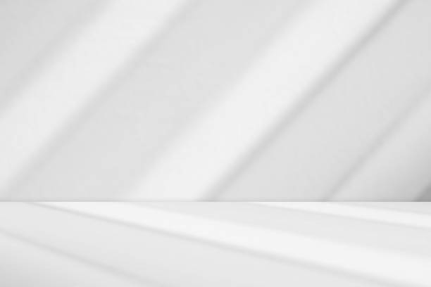 istock Abstract white studio room with light and shadow from window background for product display presentation 2183370942