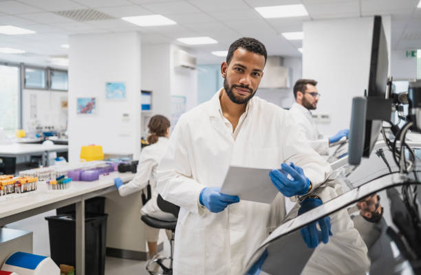 istock Diverse Male Scientist Analyzing Results in Lab 2183371466