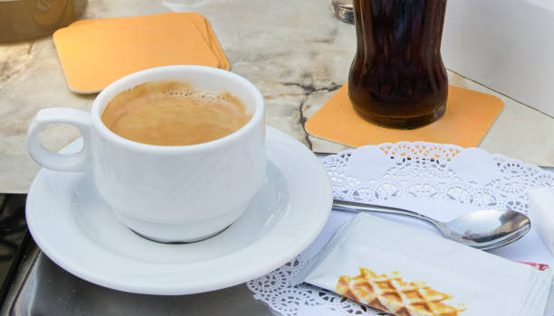 istock Cup of coffee in a morning cafe 2183371677