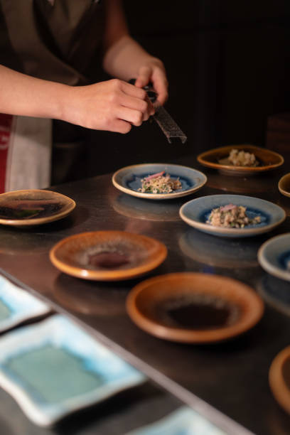 istock Chef Preparing Plating Group of Fresh Dishes On Small Plates 2183379522