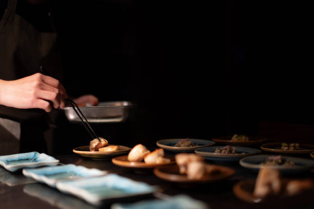 istock Chef Preparing Plating Group of Fresh Dishes On Small Plates 2183379539