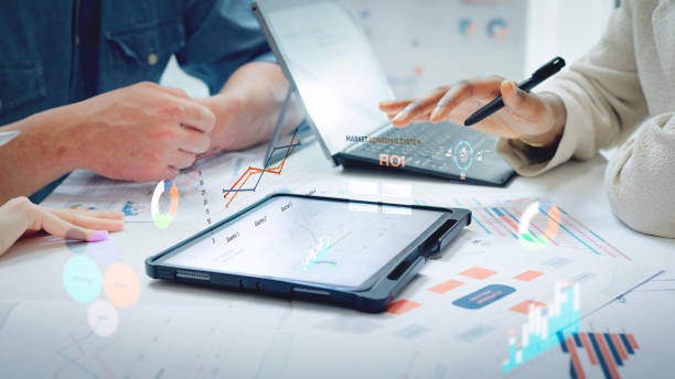 istock Close up Diverse Collaborative Business people meeting on devices computer with digital generate animated
 brainstorming the financial report paperwork document analyzing data  planning strategies displays a graph or chart in a modern business technology 2183385407
