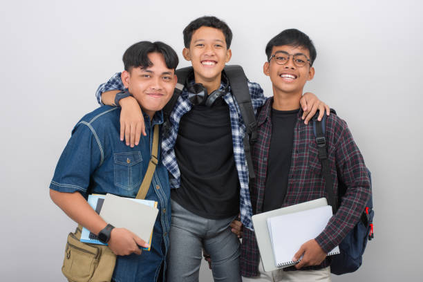 Group portrait of happy student having fun together isolated on white background