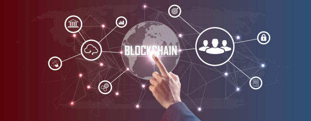 istock Hand touching a smart contract and executing a cryptocurrency transaction with blockchain technology. The transaction is secure and transparent, and there are other people in the background. 2183393538