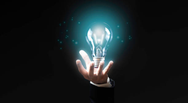 istock Businessman holding light bulbs on palm represent new ideas, innovative, technology and creativity in business. 2183393599