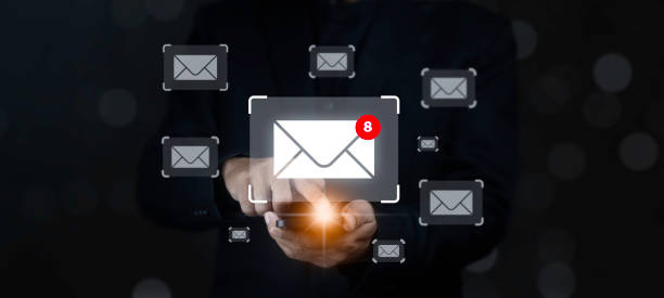 istock Businessman using smartphone check electronic mail with email icon on dark background. 2183393790