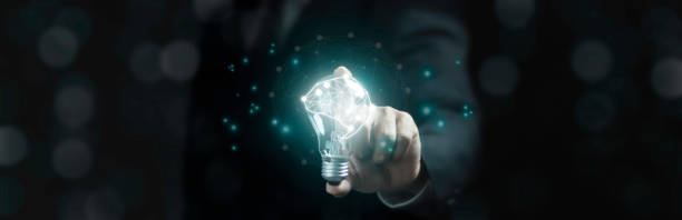 istock Businessman holding a bright brain light bulb, symbolizing creativity and innovation. 2183393969