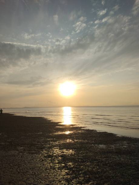 istock The sunrise on the beach is very beautiful 2183396378