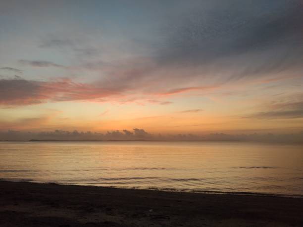 istock The sunrise on the beach is very beautiful 2183396418