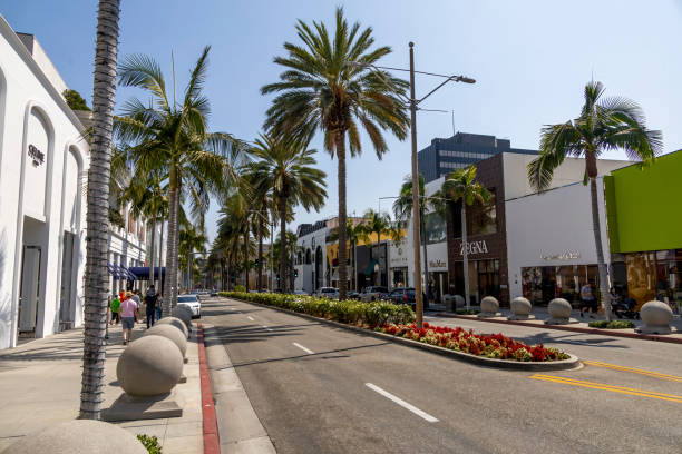 Iconic Rodeo Drive in Beverly Hills, California, lined with luxury stores and palm trees, is a world-renowned shopping destination.