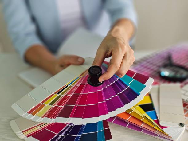 istock Selecting color palettes for design projects at a workspace with swatches and tools in view concept 2183405189