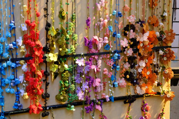 Lacework attached to traditional Turkish handcrafted scarves. Colorful lace necklaces. Turkish handicrafts. Traditional arts.