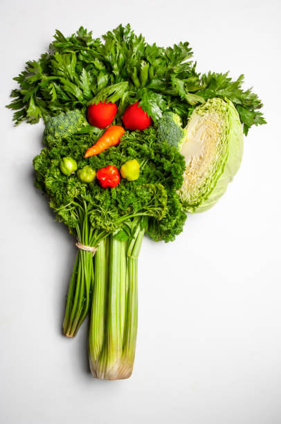 istock Fresh vegetables arranged in a funny face shape promoting healthy eating 2183406404