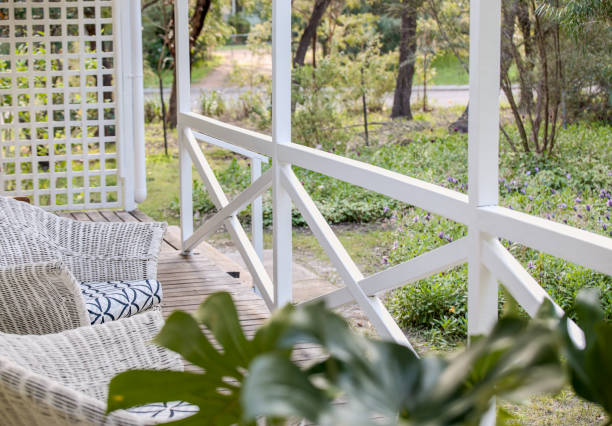 istock Cottage porch looking out to trees 2183407418