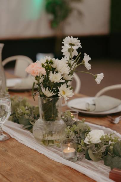 istock Elegant wedding table setting with flowers and glasses, perfect for a romantic celebration 2183409542