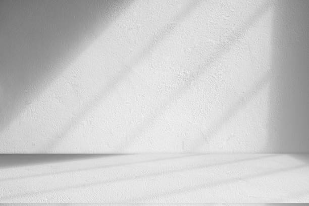 istock Wall interior background, studio and backdrops show products.with shadow from window color white . background for text insertion and presentation product 2183409575