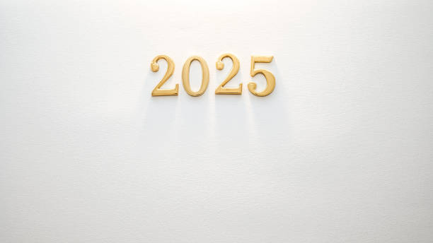 istock Gold numbers display the year 2025 on a clean white texture in a minimalist space 2183410768