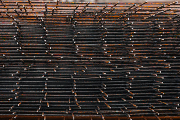 Rust Iron grate concrete pavement, cement wall reinforcement steel frame, rusty at a construction site