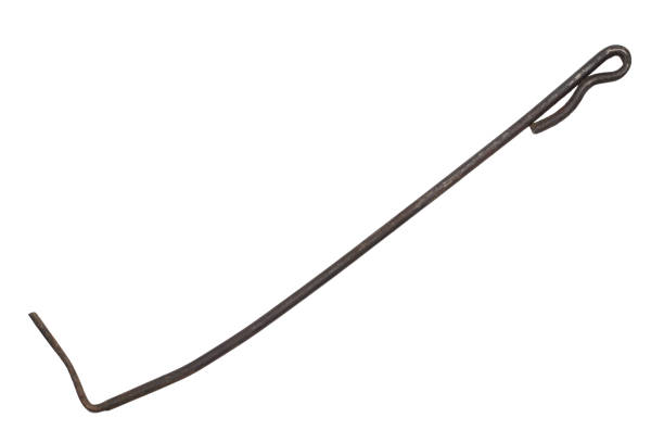 Old iron poker for the stove on a white background. Poker isolated.