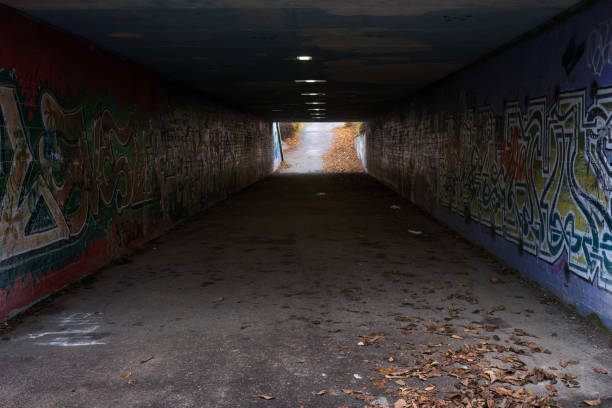Way out, Exit way, Fast moving zoom motion blur tunnel road escape, rushing towards brightly light ahead
