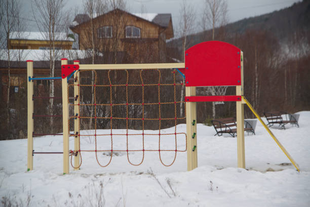 Playground that is densely covered with snow in winter.