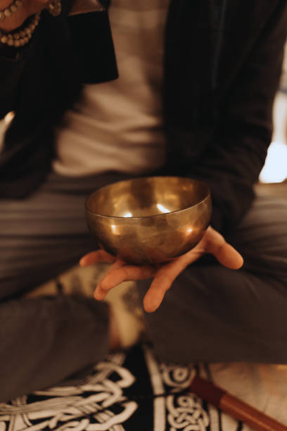 istock Meditation Session with Tibetan Singing Bowl and Healing Instruments on Ornate Mat 2183417553