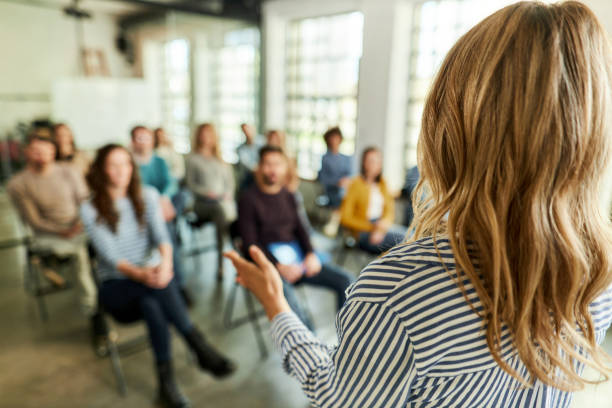 istock Back view of a female speaker talking on presentation in the office. 2183417844