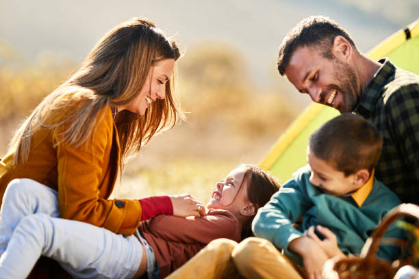 istock Cheerful family having fun in autumn day. 2183419508