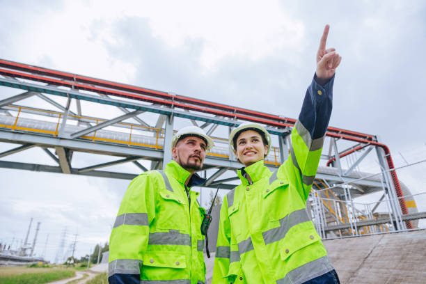 istock Engineer oil and gas refinery pipe service team worker working together in petroleum pipeline industry. 2183419614