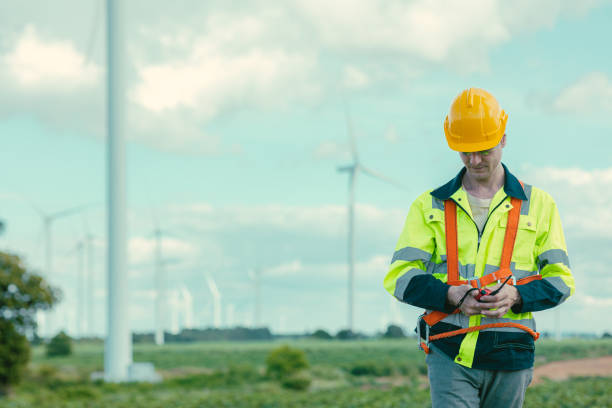 istock Caucasian Engineer technician male worker working service maintenance wind turbine at Wind Turbines electricity generator farm field outdoors. 2183419640