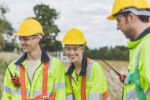 istock Happy smiling and laughing engineer team workers talking together relax at work. 2183419655