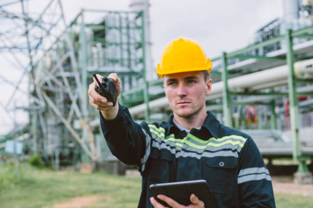 istock Engineer worker working operate outdoor, Petroleum gas pipe oil transport pipeline and construction building project manager for refinery industry. 2183419694