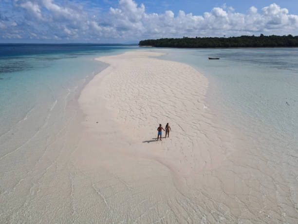 istock Couple Walking on Isolated Sandbar in Tropical Waters 2183420104