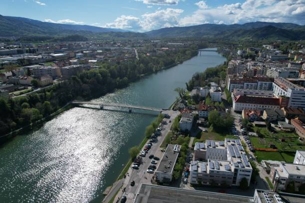 istock Aerial cityscape with river and greenery. 2183420635