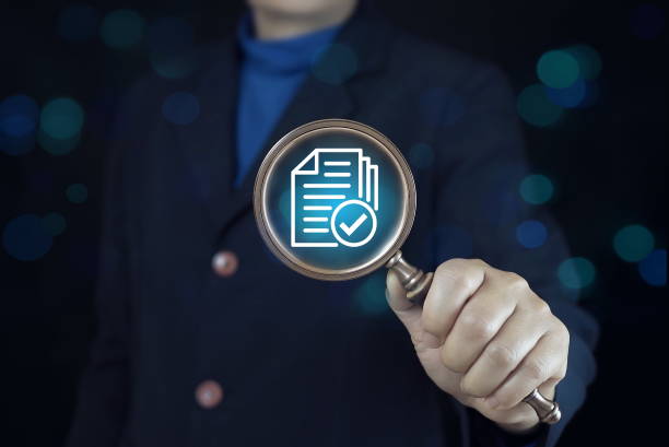 istock Document with correct sign mark inside of magnifier glass for prepare check and approve document , ISO quality control and assurance concept. 2183425461