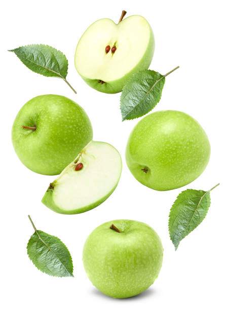istock flying green apples with green leaf and slices isolated on a white background. clipping path 2183426544