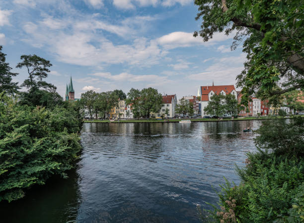 istock Tranquil Riverside View of Historic German city Lubeck 2183427320